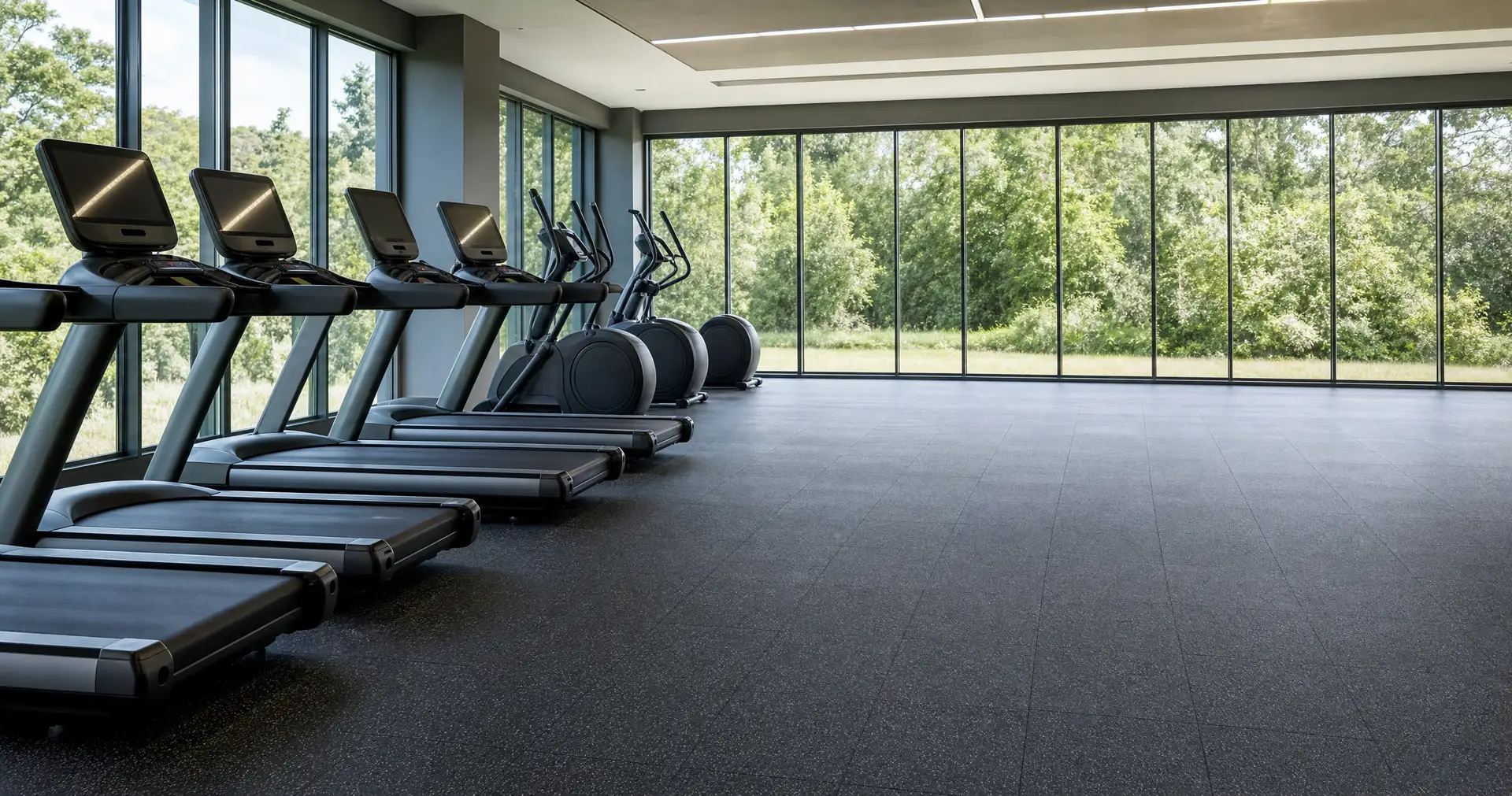 A row of unoccupied training machines under high ceilings